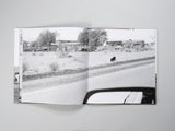 John Divola - Dogs Chasing My Car in the Desert